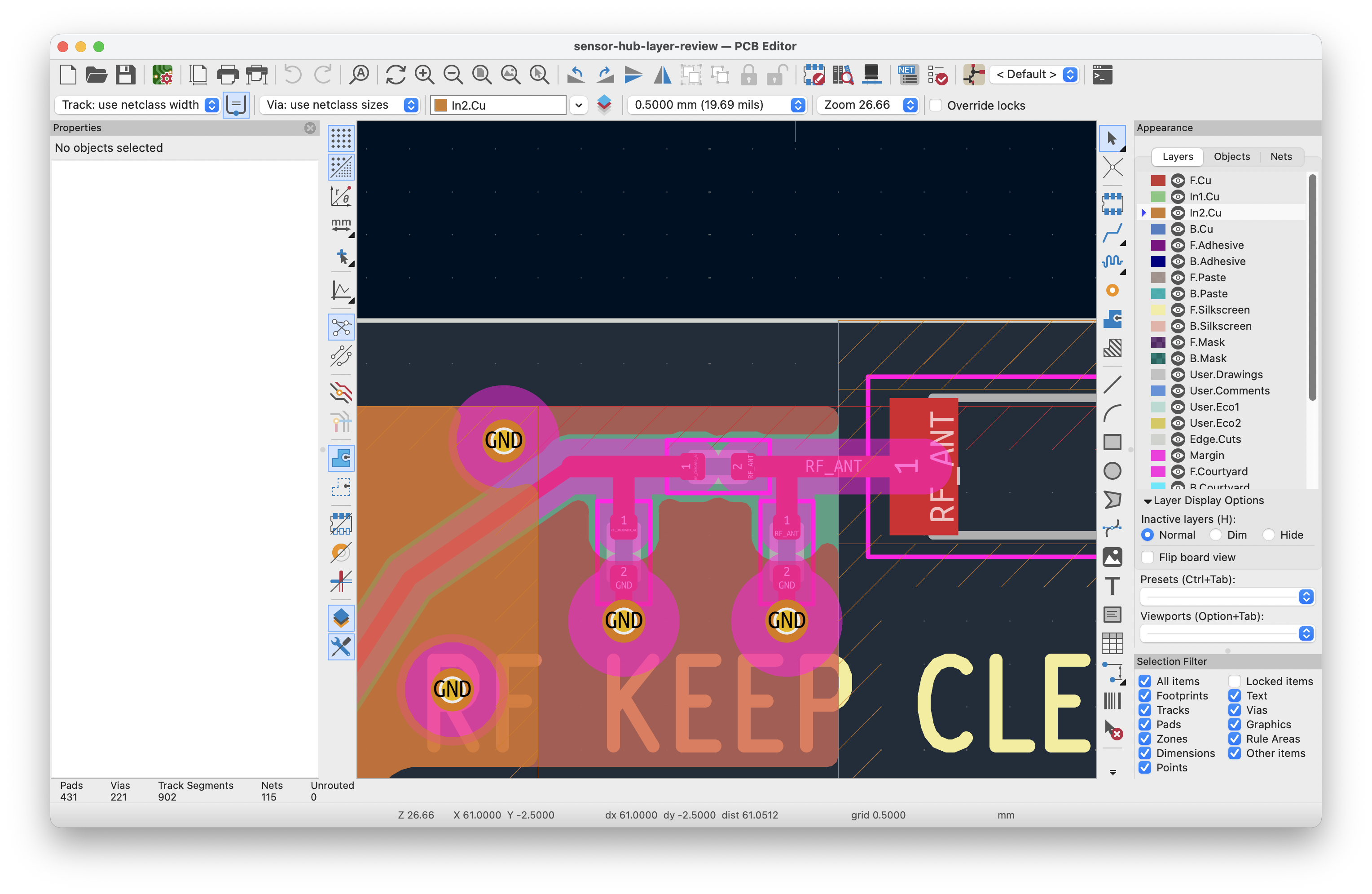 KiCad antenna-area view with orange In2.Cu selected, green In1.Cu visible, and GND vias